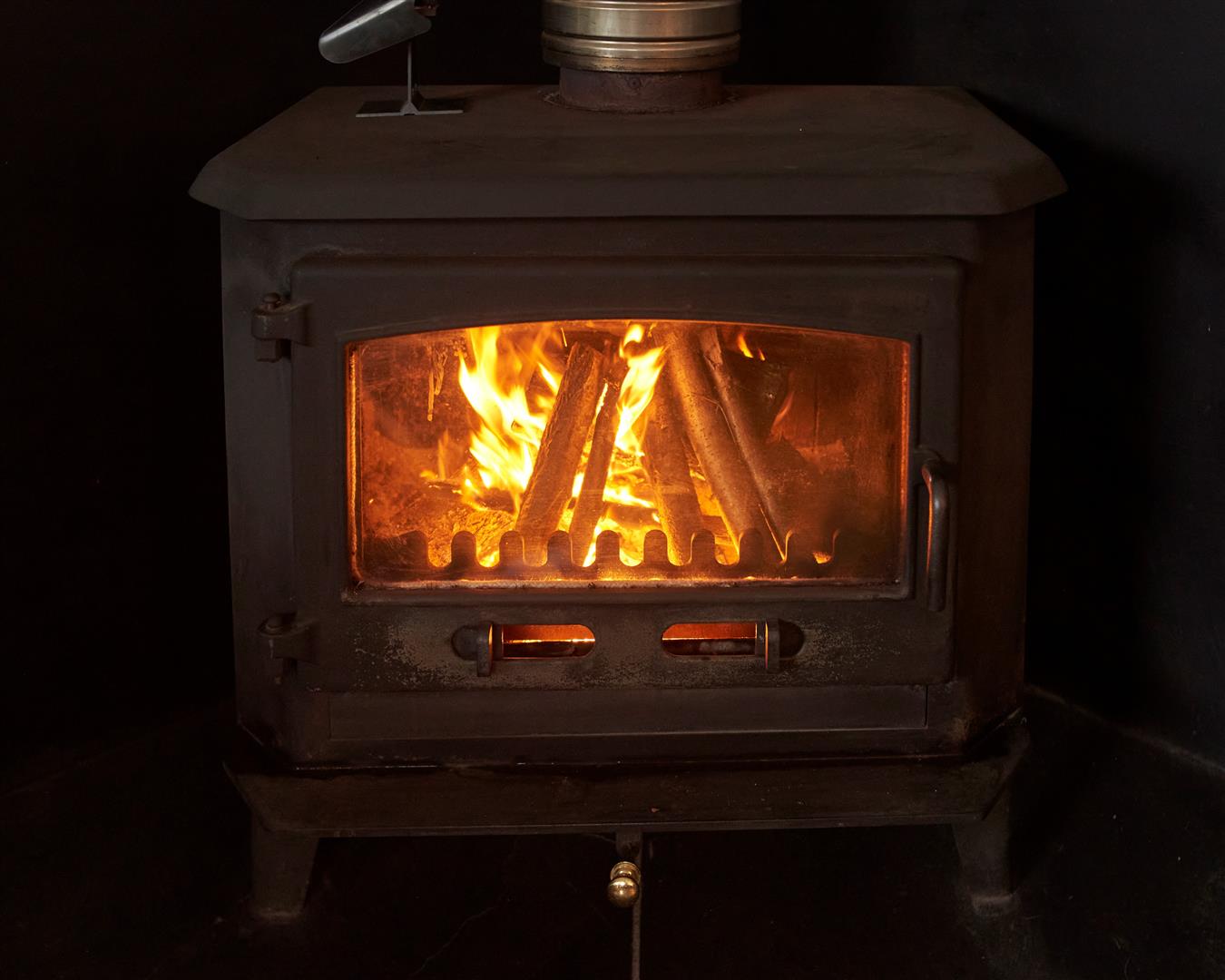 Wood burning stove with fire alight